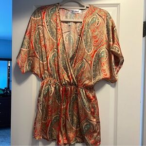 Multi colored romper size small. NWOT.